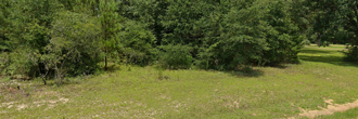 Over an acre of lovely property in a charming town by multiple lakes