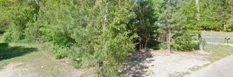 Build your starter house on this flat treed lot